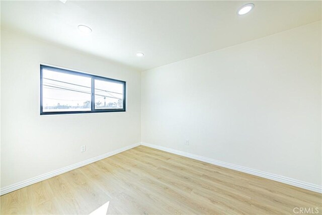 empty room featuring light hardwood / wood-style floors