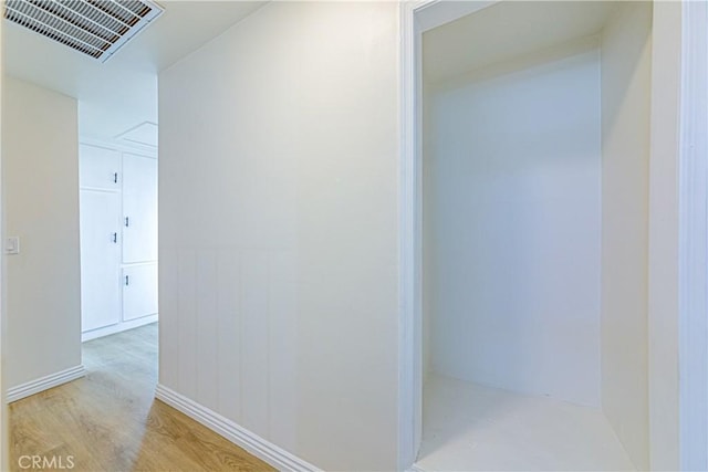 hallway featuring light hardwood / wood-style flooring
