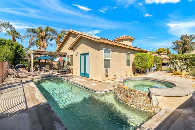 view of pool featuring an in ground hot tub, a pergola, and a patio area