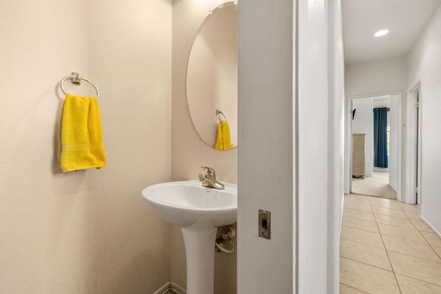 bathroom with tile patterned floors