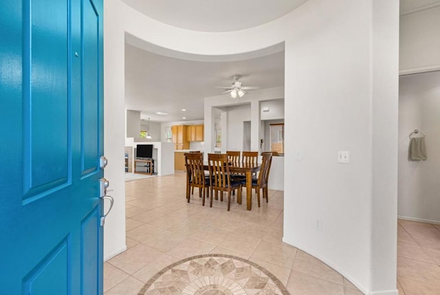 entryway with light tile patterned floors and ceiling fan