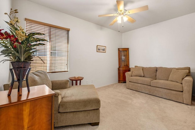 carpeted living room featuring ceiling fan