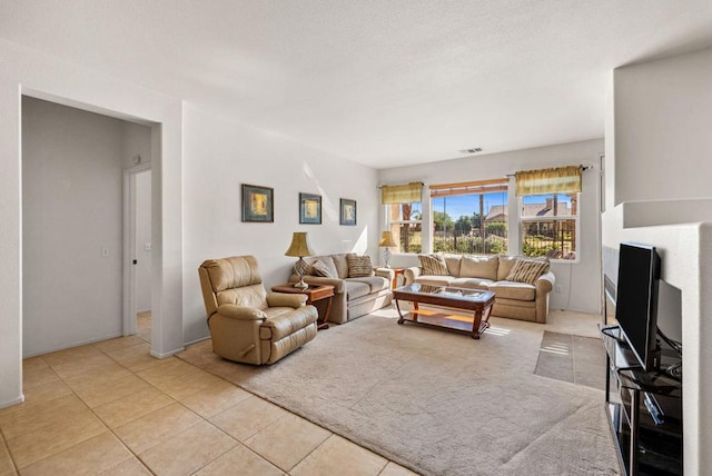 living room with light tile patterned flooring