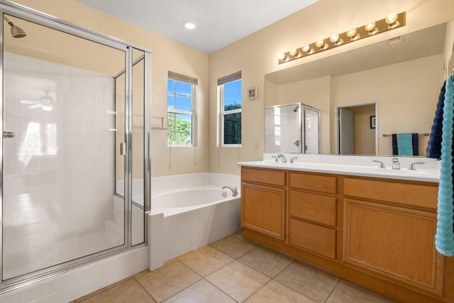 bathroom with tile patterned flooring, vanity, independent shower and bath, and ceiling fan