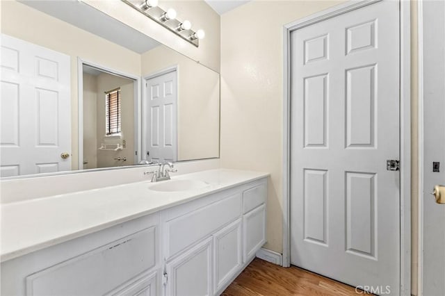 bathroom featuring wood-type flooring and vanity