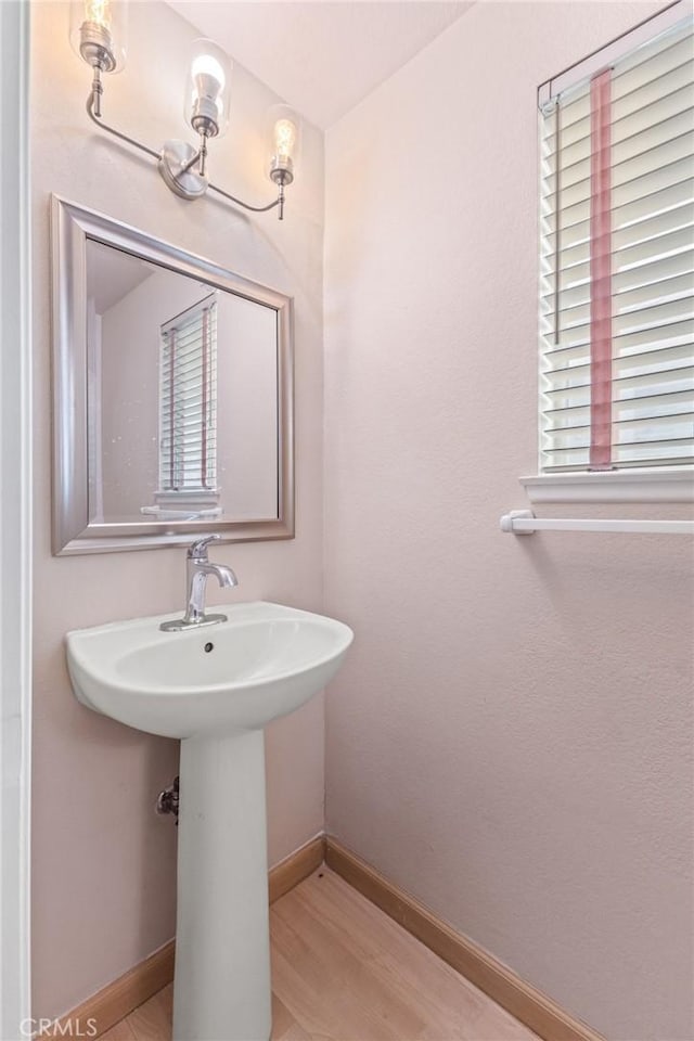 bathroom featuring hardwood / wood-style flooring and sink