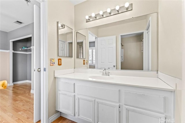 bathroom featuring vanity and hardwood / wood-style floors