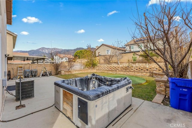 view of patio / terrace featuring a mountain view and central air condition unit