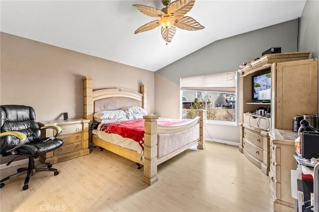 bedroom featuring ceiling fan, lofted ceiling, and light hardwood / wood-style flooring