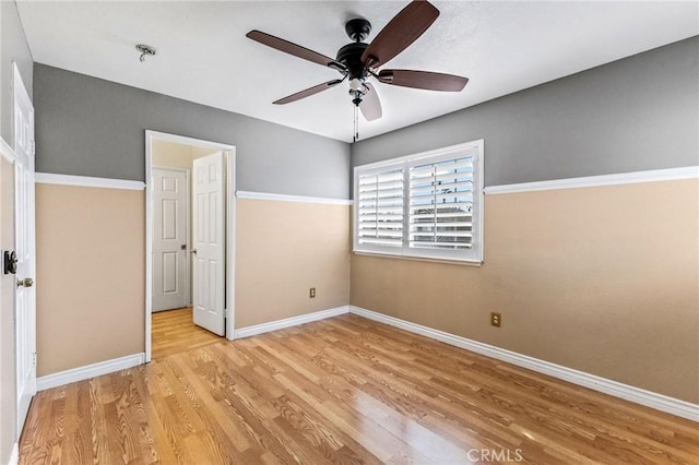 unfurnished bedroom featuring ceiling fan and light wood-type flooring