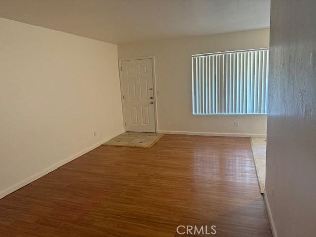 empty room featuring wood-type flooring