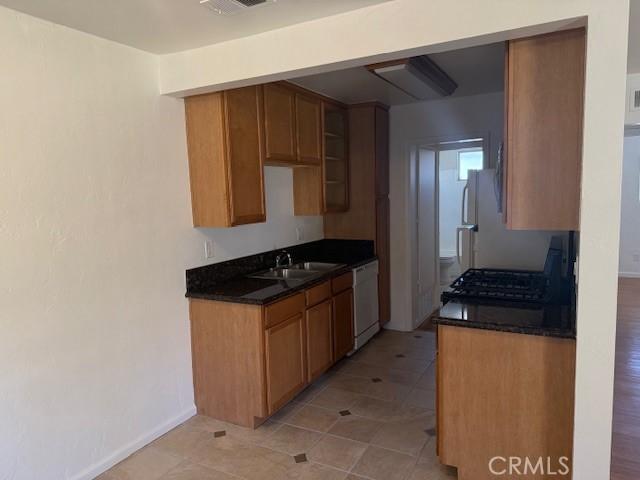 kitchen with sink and white appliances