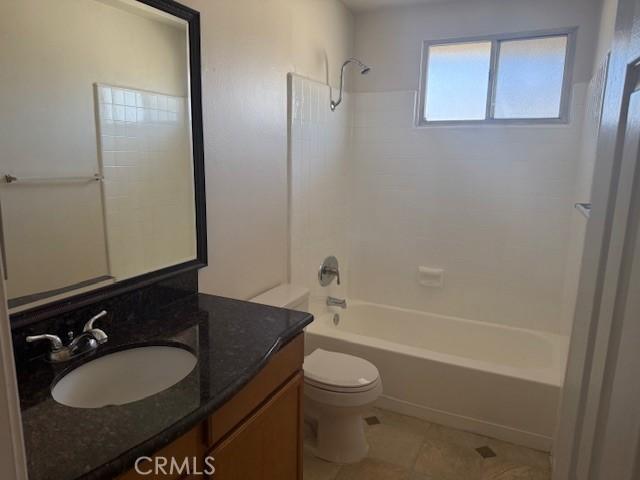 full bathroom with toilet, bathing tub / shower combination, tile patterned flooring, and vanity