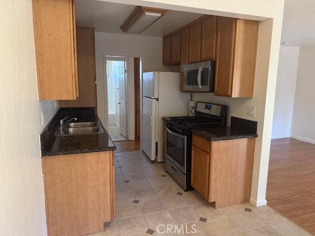 kitchen with sink and stainless steel appliances