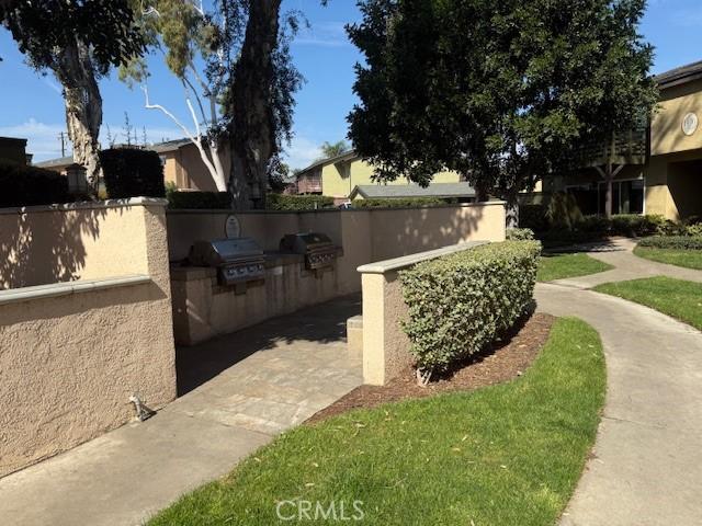 view of side of property featuring area for grilling