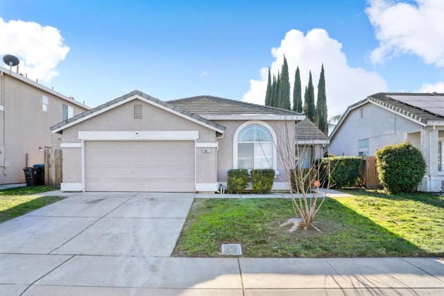 view of front facade featuring a garage and a front yard