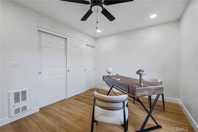 office with ceiling fan and wood-type flooring