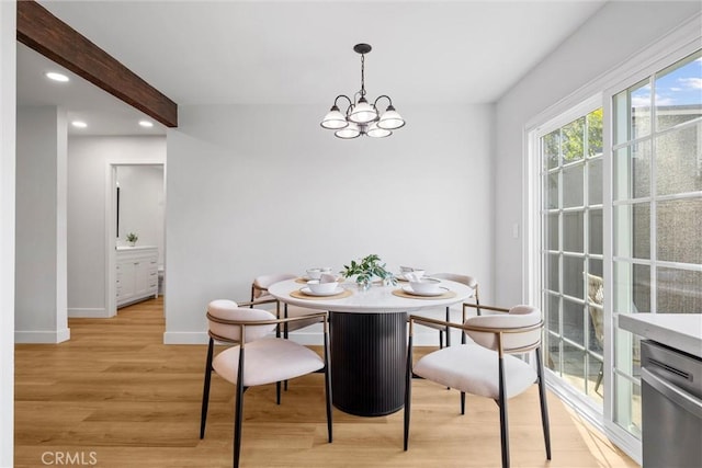 dining area with beam ceiling, light hardwood / wood-style floors, and a chandelier