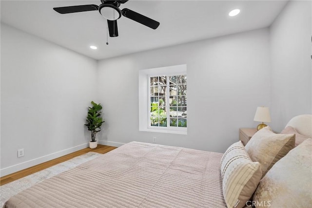 bedroom featuring ceiling fan and wood-type flooring