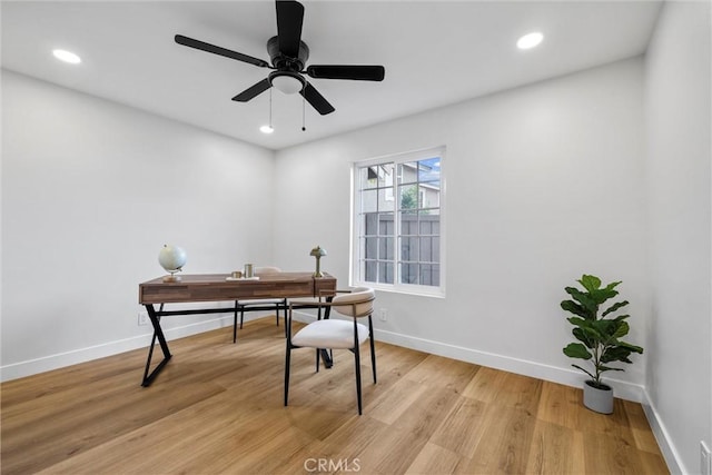 office area with ceiling fan and light hardwood / wood-style flooring