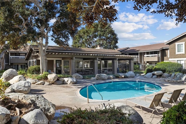 view of pool featuring a patio area