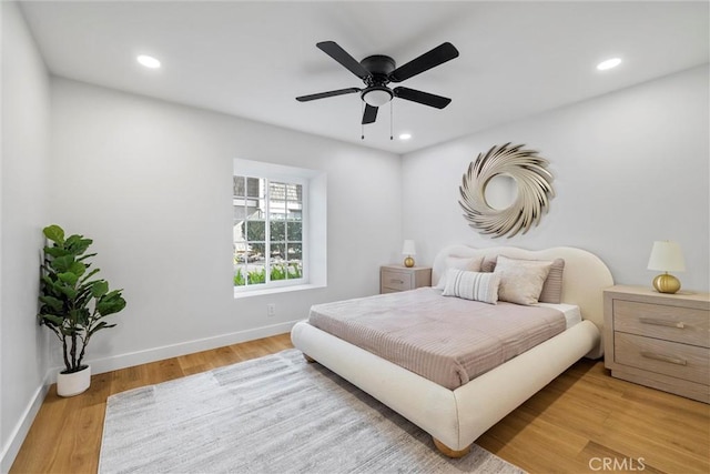 bedroom featuring ceiling fan and light hardwood / wood-style floors