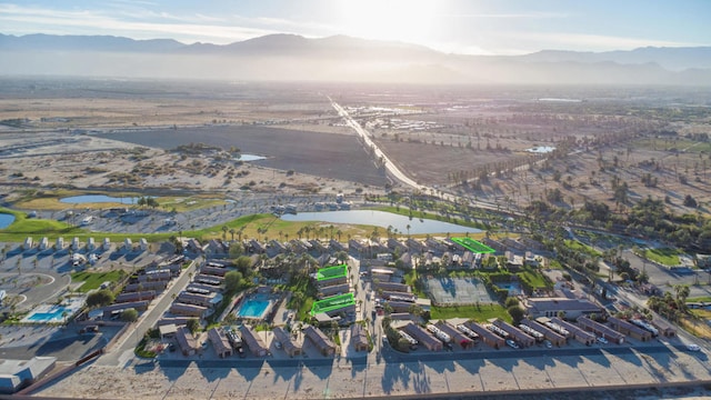 birds eye view of property featuring a water and mountain view