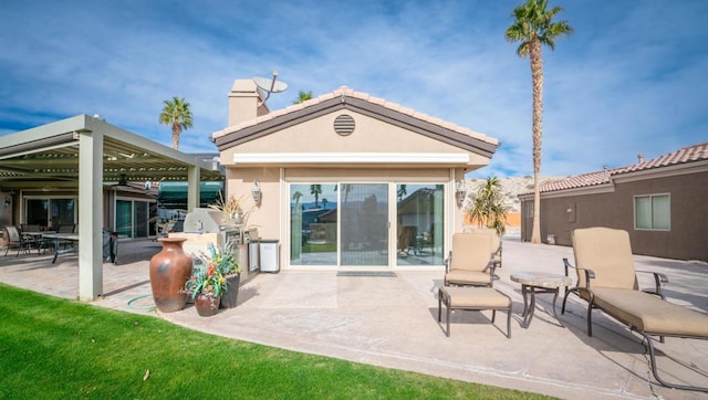 rear view of property with a patio area