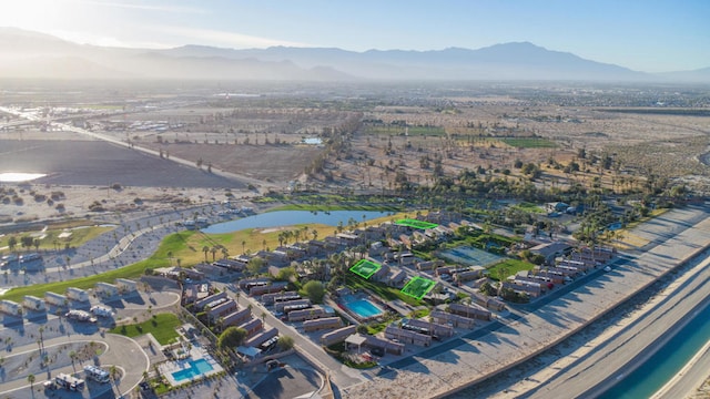 bird's eye view with a water and mountain view