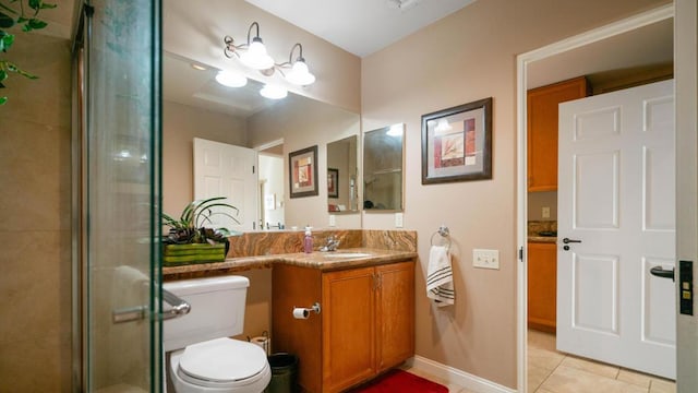 bathroom featuring vanity, toilet, a shower with shower door, and tile patterned flooring