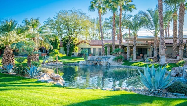 view of pool with a lawn