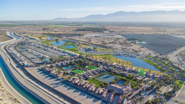 aerial view featuring a water and mountain view