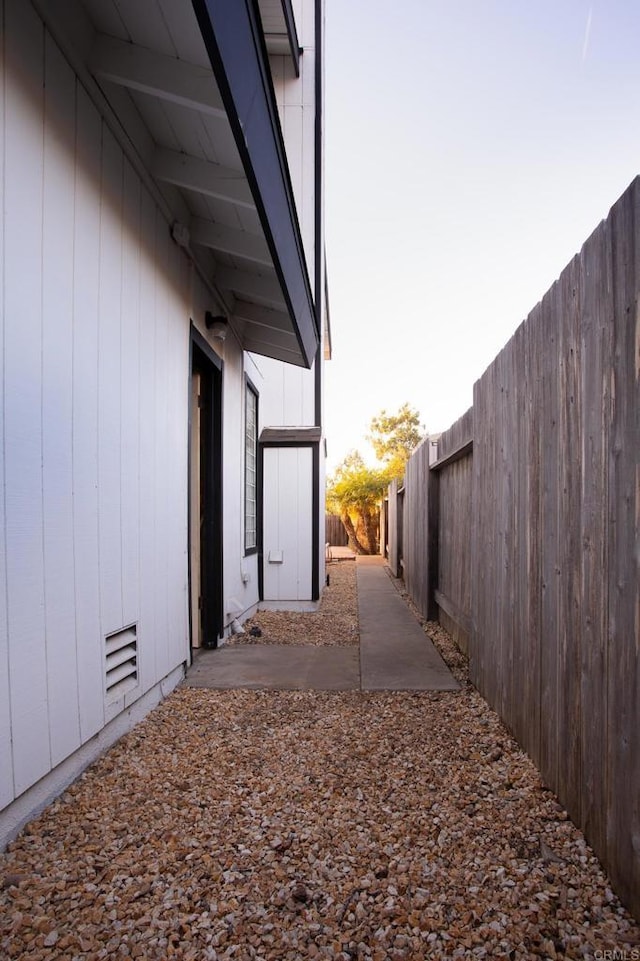 view of property exterior with a patio area