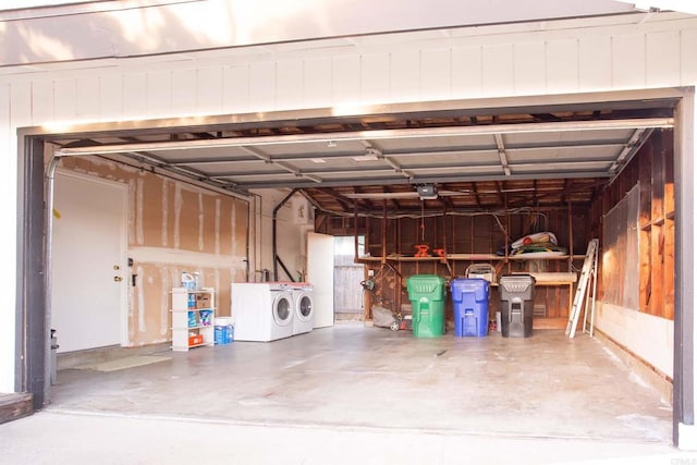 garage featuring a garage door opener and washing machine and clothes dryer