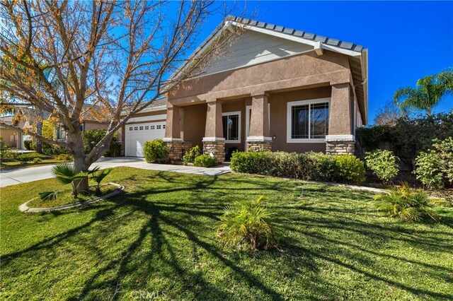 view of front of house with a garage and a front yard