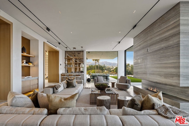 view of patio with an outdoor living space and a mountain view