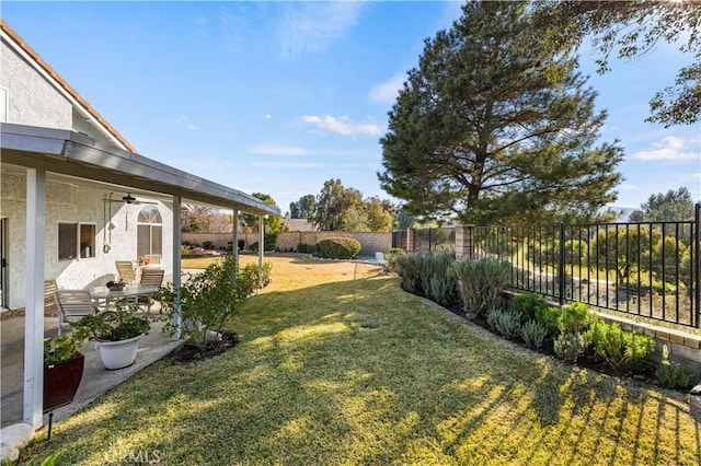 view of yard featuring ceiling fan