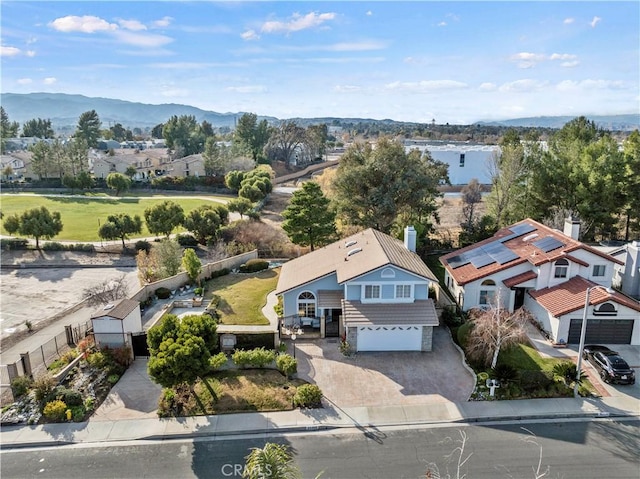 birds eye view of property featuring a mountain view