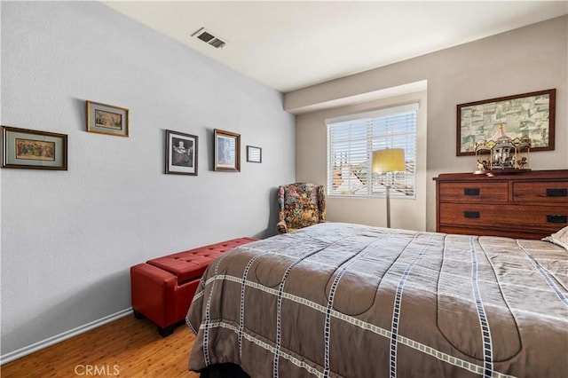 bedroom featuring light hardwood / wood-style floors