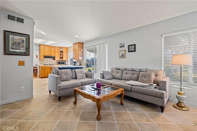 living room with light tile patterned floors