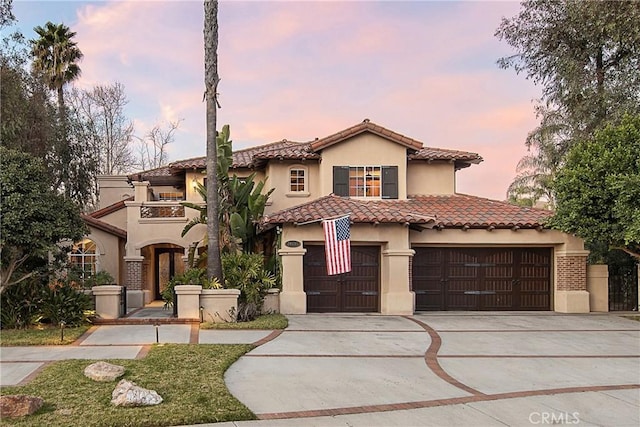 mediterranean / spanish house featuring a garage