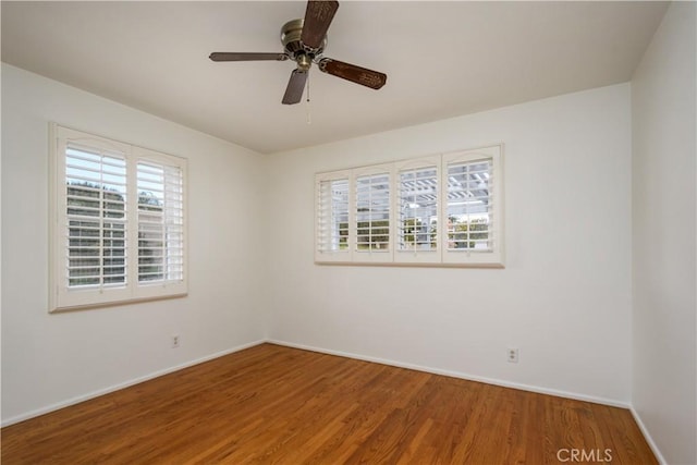 unfurnished room featuring hardwood / wood-style flooring and ceiling fan