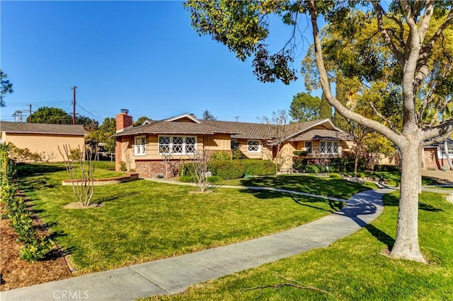 ranch-style home featuring a front yard