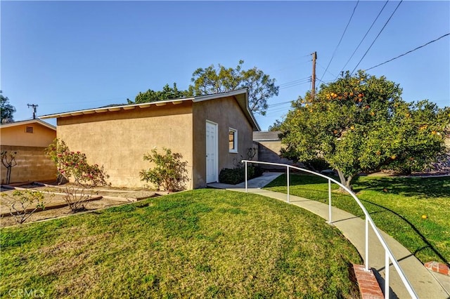 view of side of home featuring a yard