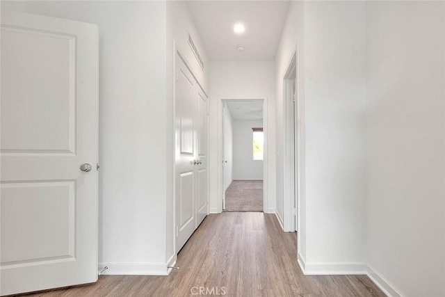 corridor featuring hardwood / wood-style floors