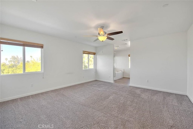 unfurnished room with light carpet and ceiling fan