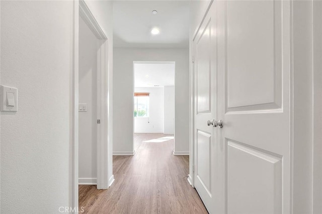 corridor featuring light hardwood / wood-style floors