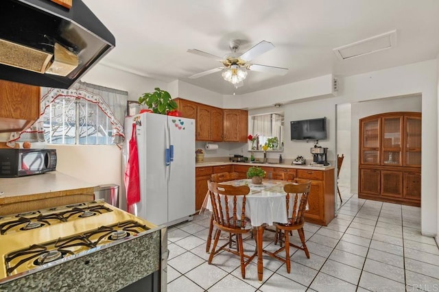 kitchen with sink, ceiling fan, extractor fan, range with gas stovetop, and white fridge