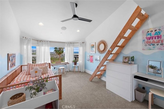 carpeted bedroom featuring ceiling fan and lofted ceiling