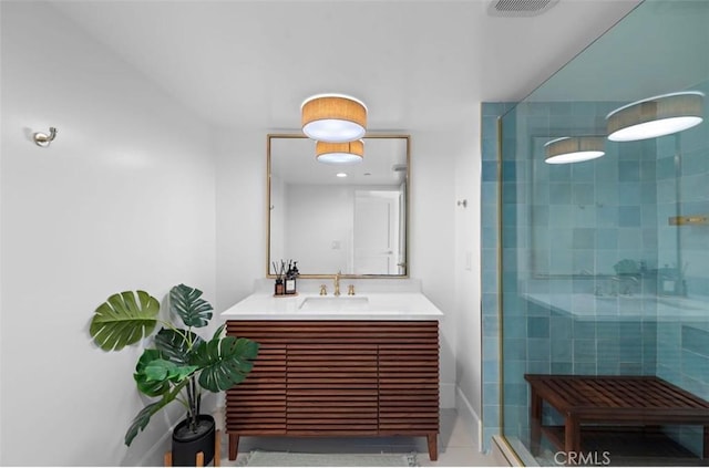 bathroom featuring an enclosed shower and vanity